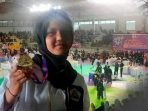 Syifa Halimatu Sadiah XI TKJ 2 memperoleh medali emas Open Tournament pencak silat Nasional